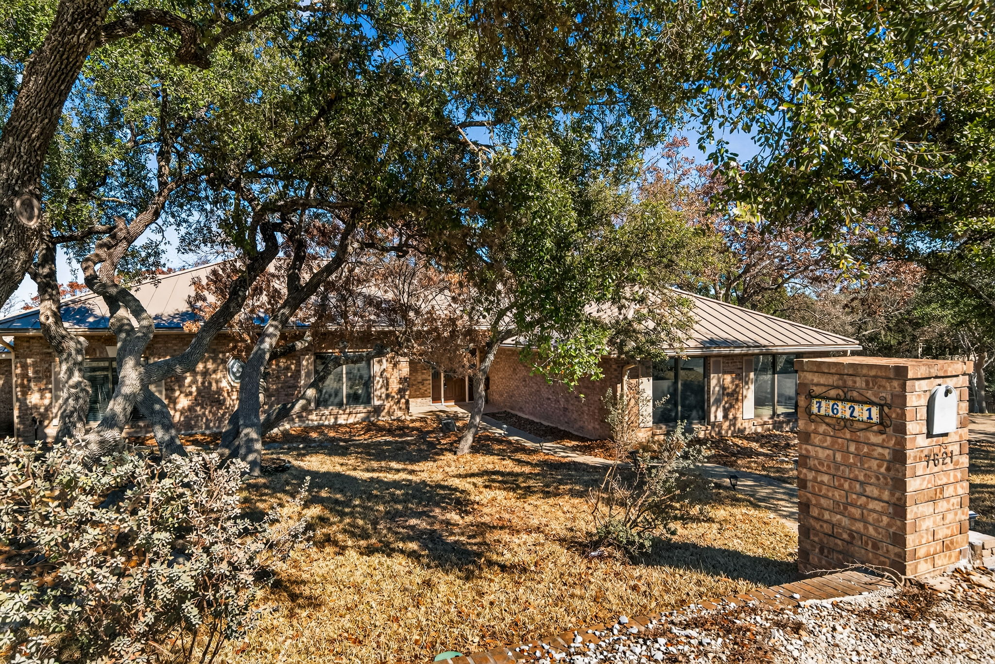 a view of a house with a tree