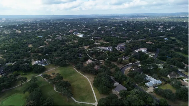 an aerial view of city and lake