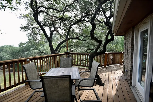 a view of a balcony with wooden floor