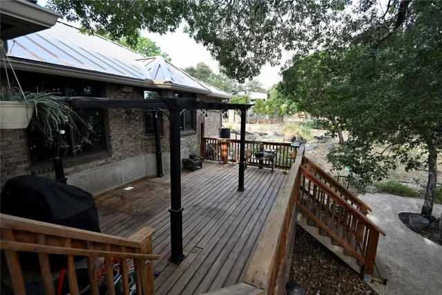 a view of a chairs and table in the balcony