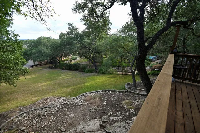 a view of a park with large trees