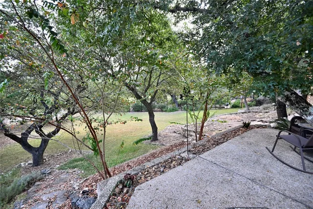 a view of a backyard of the house