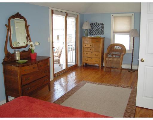 124 Turner Road Scituate, MA 02066 - Photo 3 of 7 a living room with furniture and a wooden floor