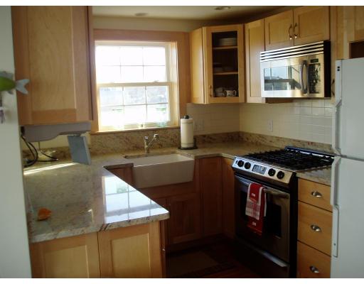 124 Turner Road Scituate, MA 02066 - Photo 6 of 7 a kitchen with a stove and a microwave