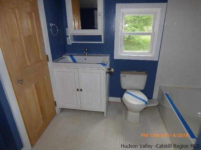 111 Patch Road Saugerties, NY 12477 - Photo 11 of 21 a bathroom with a toilet sink and mirror