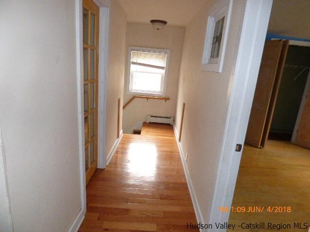 111 Patch Road Saugerties, NY 12477 - Photo 14 of 21 a view of a hallway with wooden floor and staircase