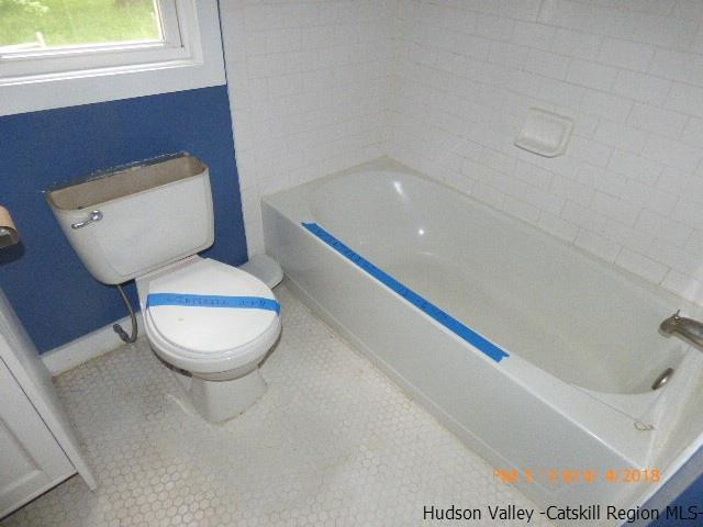 111 Patch Road Saugerties, NY 12477 - Photo 19 of 21 a bathroom with a toilet and a bathtub