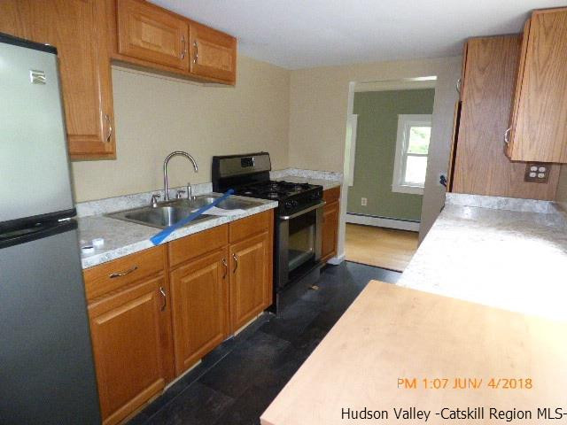 111 Patch Road Saugerties, NY 12477 - Photo 4 of 21 a kitchen with stainless steel appliances granite countertop a sink stove and cabinets