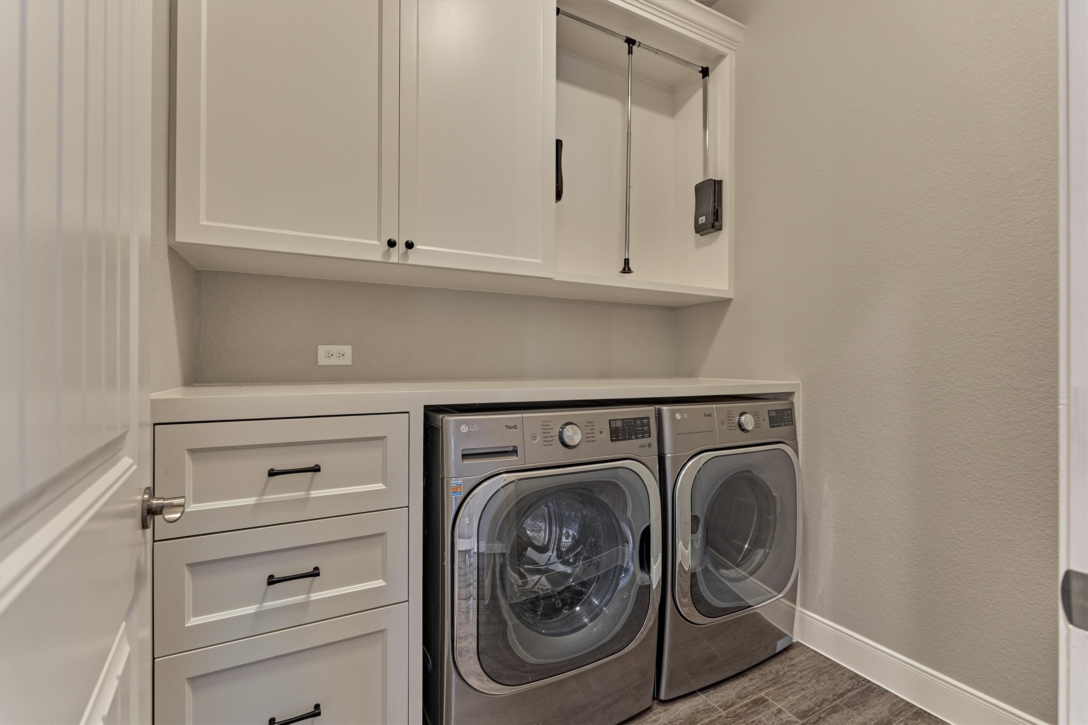 108 Wild Wick Way Spring, TX 77382 - Photo 22 of 44 The Utility Room Has Excellent Storage Along With A Hanging Cabinet.