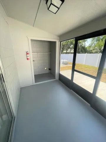 a view of an empty room with a window
