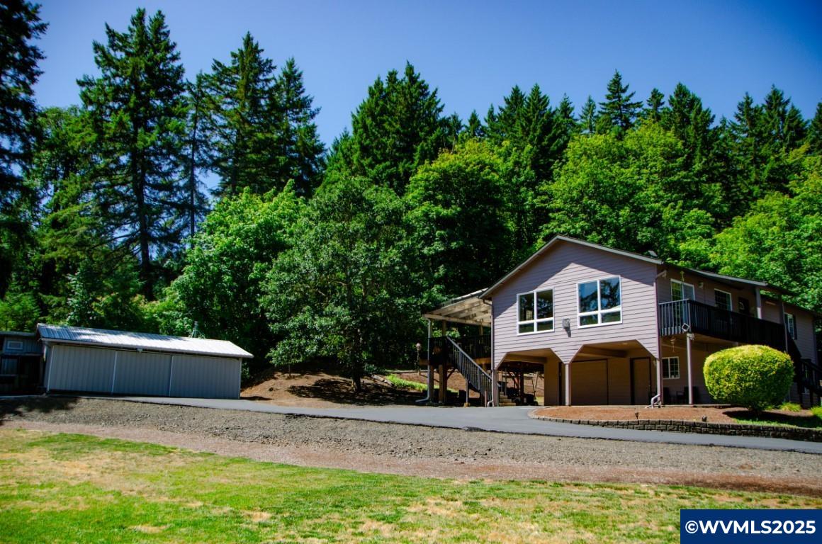 16870 Selden Road Dallas, OR 97338 - Photo 30 of 42 a front view of a house with garden