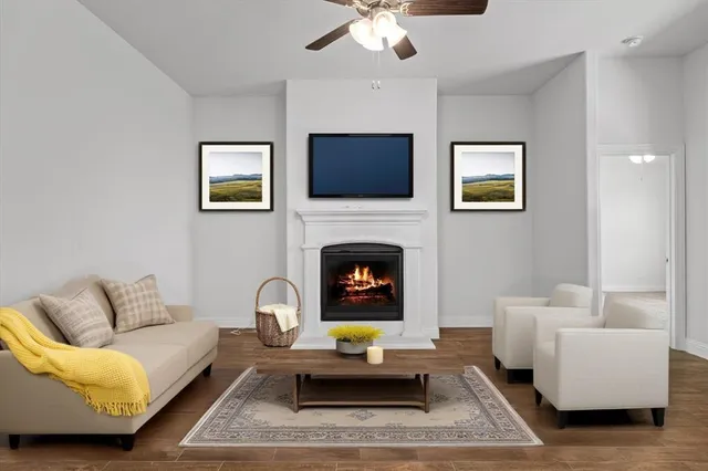a living room with furniture and a fireplace