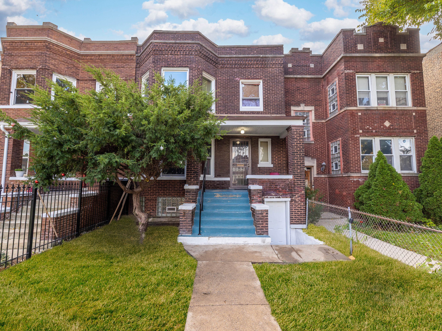 4747 West Monroe Street Chicago, IL 60644 - Photo 1 of 25 a front view of a building with garden
