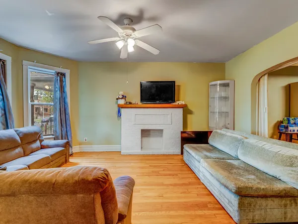 a spacious bedroom with a bed and a flat screen tv