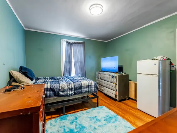 a bedroom with furniture and a bed
