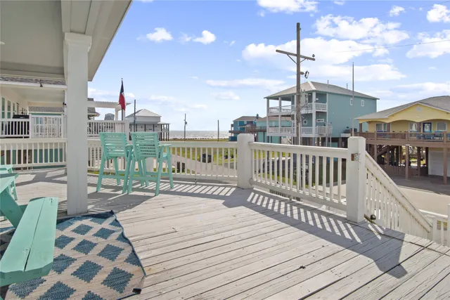 a view of a balcony with wooden floor