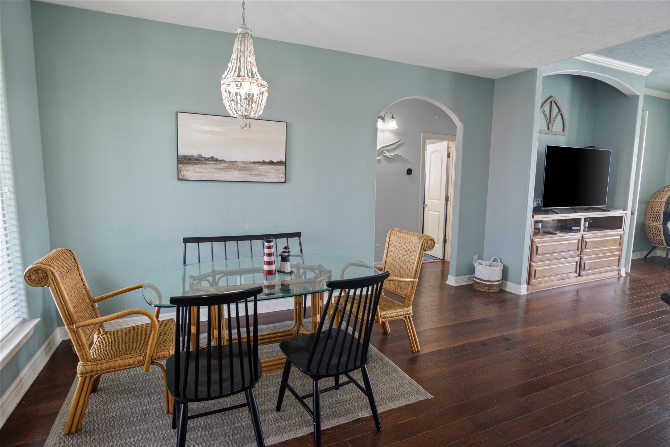 932 Kent Crystal Beach, TX 77650 - Photo 11 of 37 a view of a dining room with furniture wooden floor and chandelier