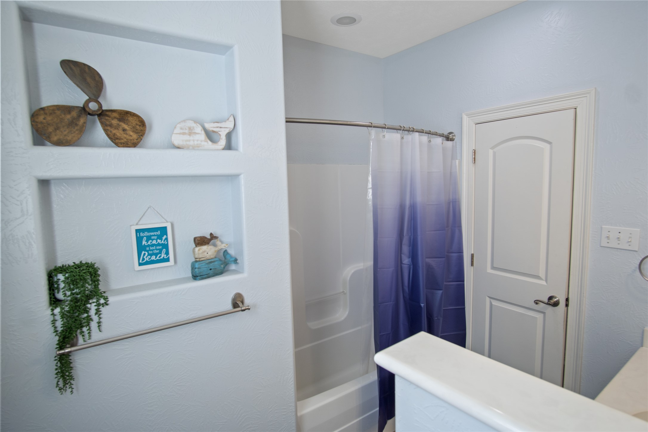 932 Kent Crystal Beach, TX 77650 - Photo 18 of 37 a bathroom with a sink a toilet and shower