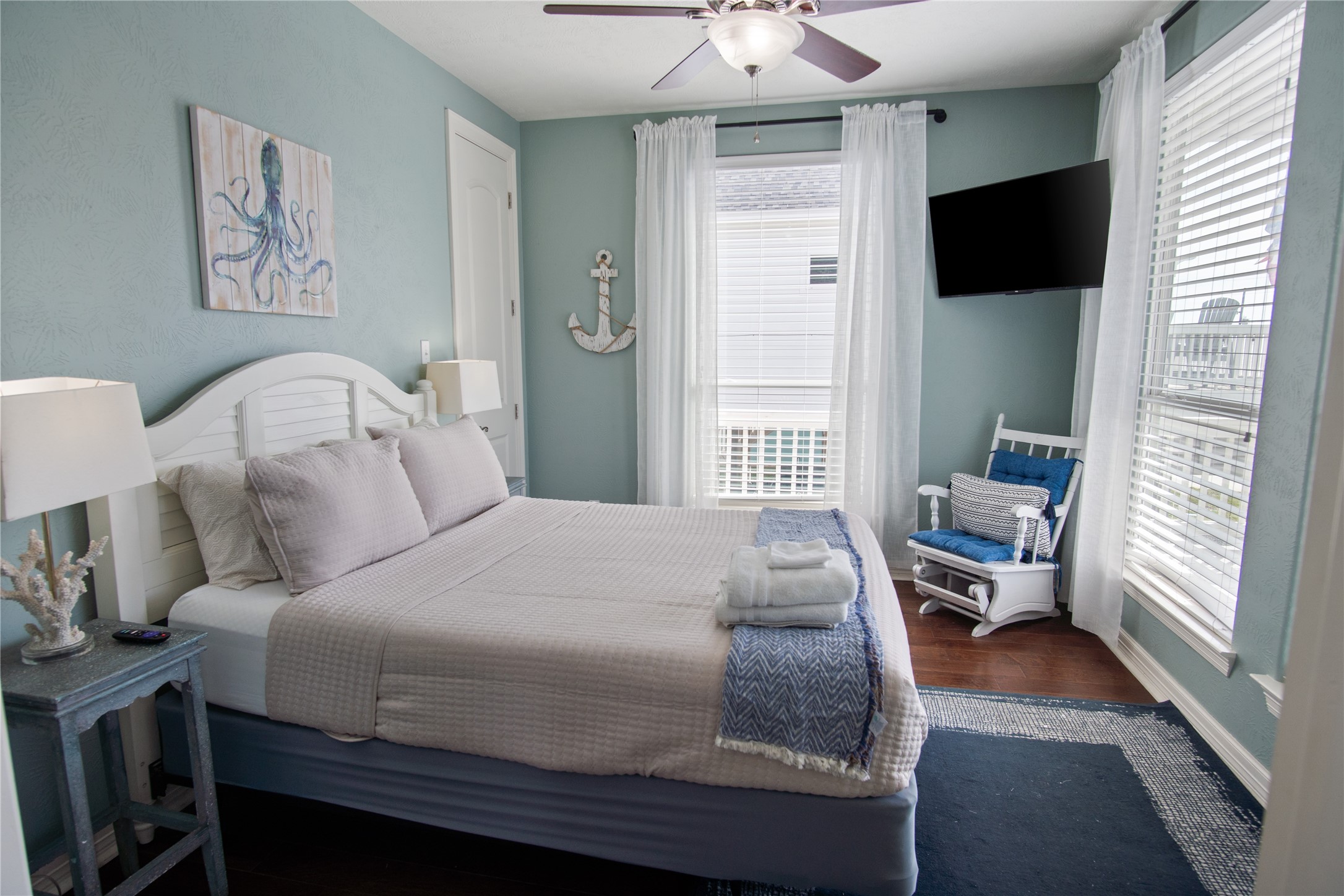 932 Kent Crystal Beach, TX 77650 - Photo 19 of 37 a bedroom with a bed and a large window