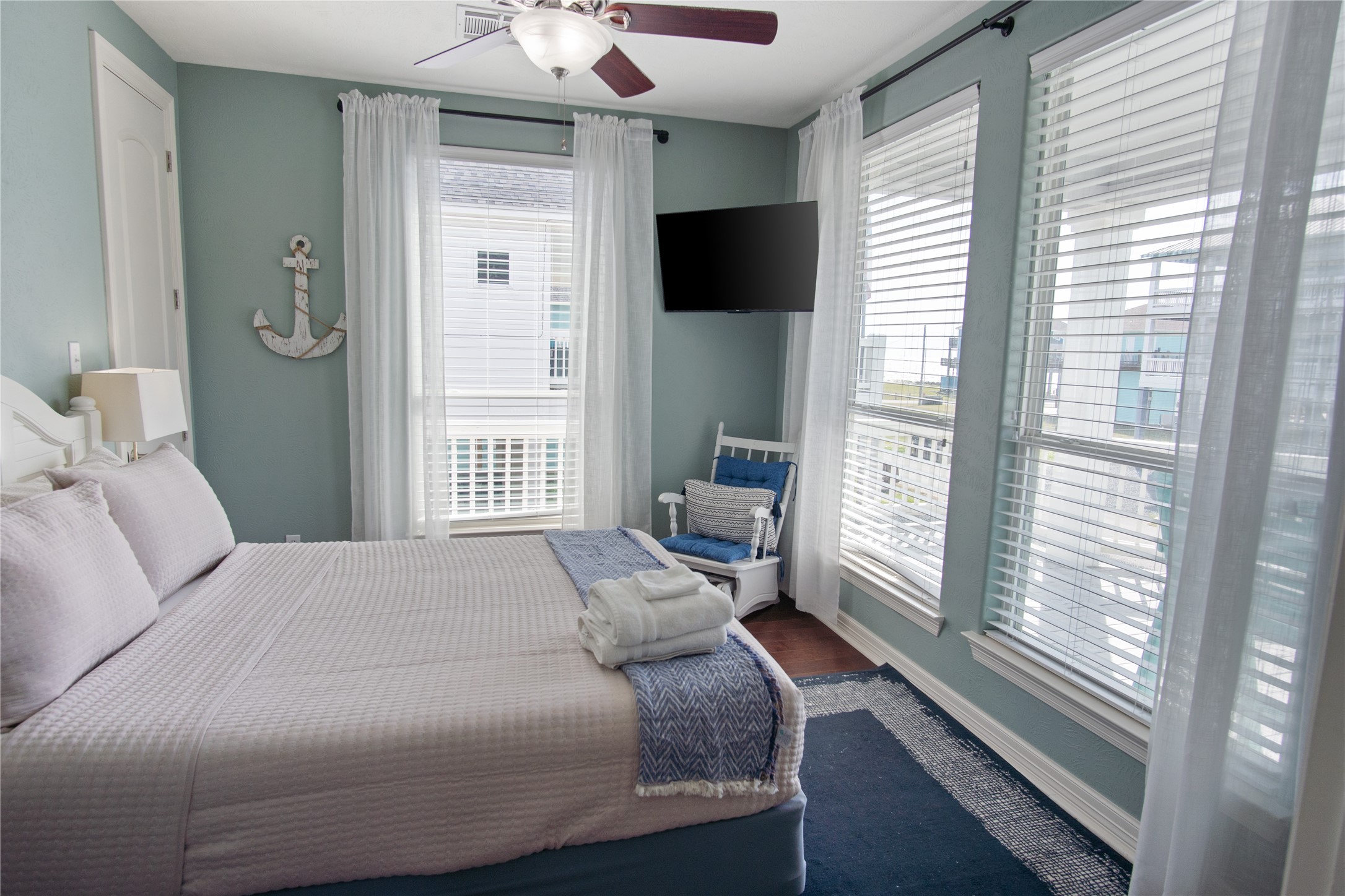 932 Kent Crystal Beach, TX 77650 - Photo 21 of 37 a bedroom with a bed and a flat tv screen on dresser