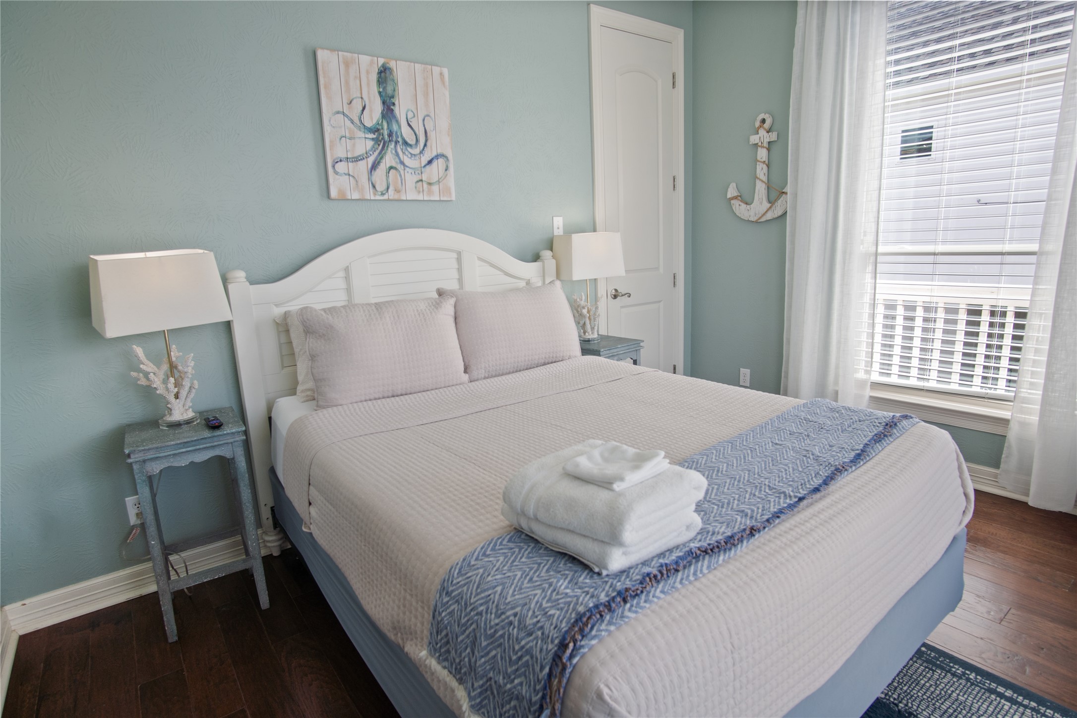 932 Kent Crystal Beach, TX 77650 - Photo 23 of 37 a bedroom with a bed and a lamp on table