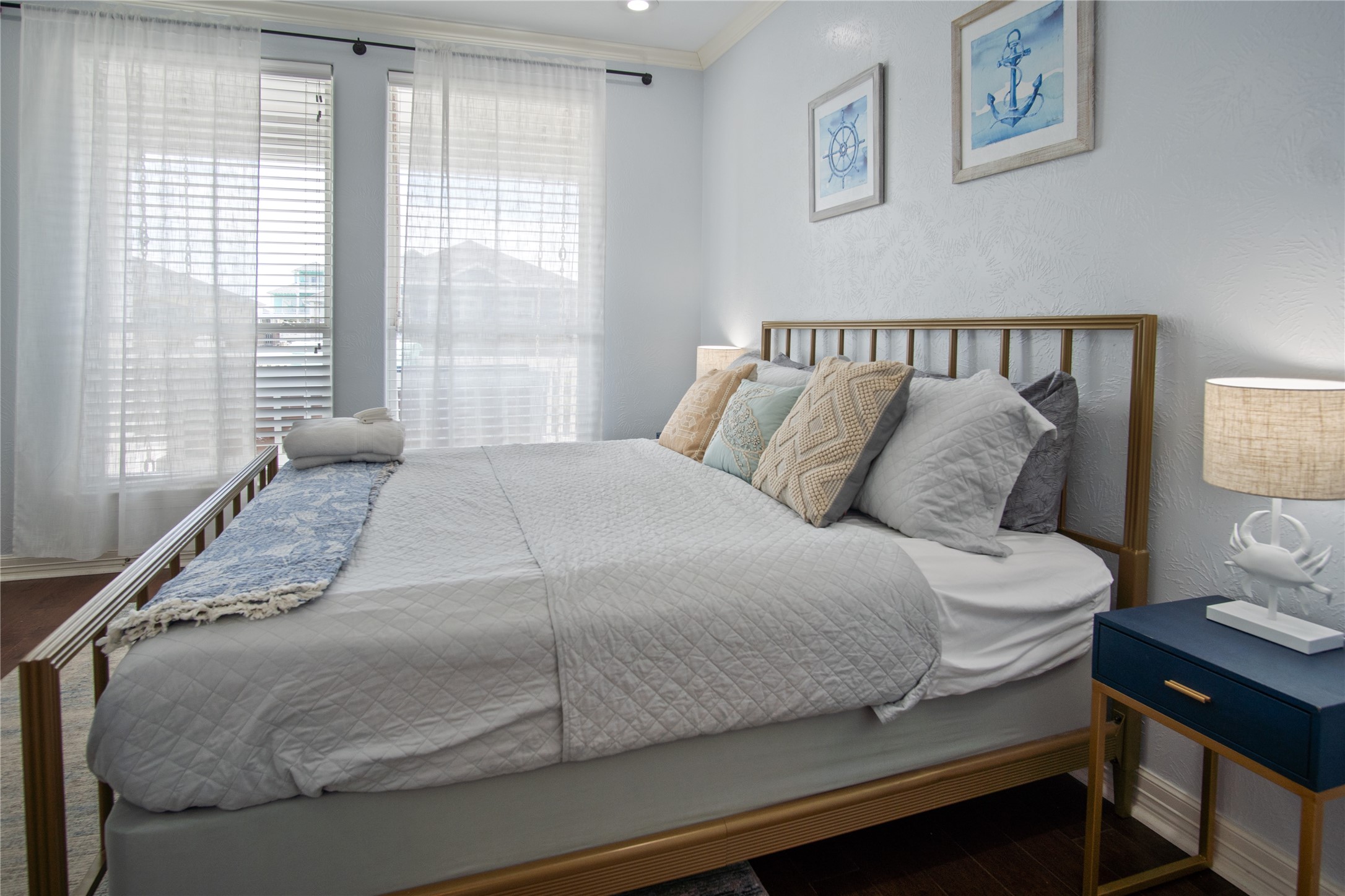 932 Kent Crystal Beach, TX 77650 - Photo 26 of 37 a large bed sitting in a bedroom next to a window