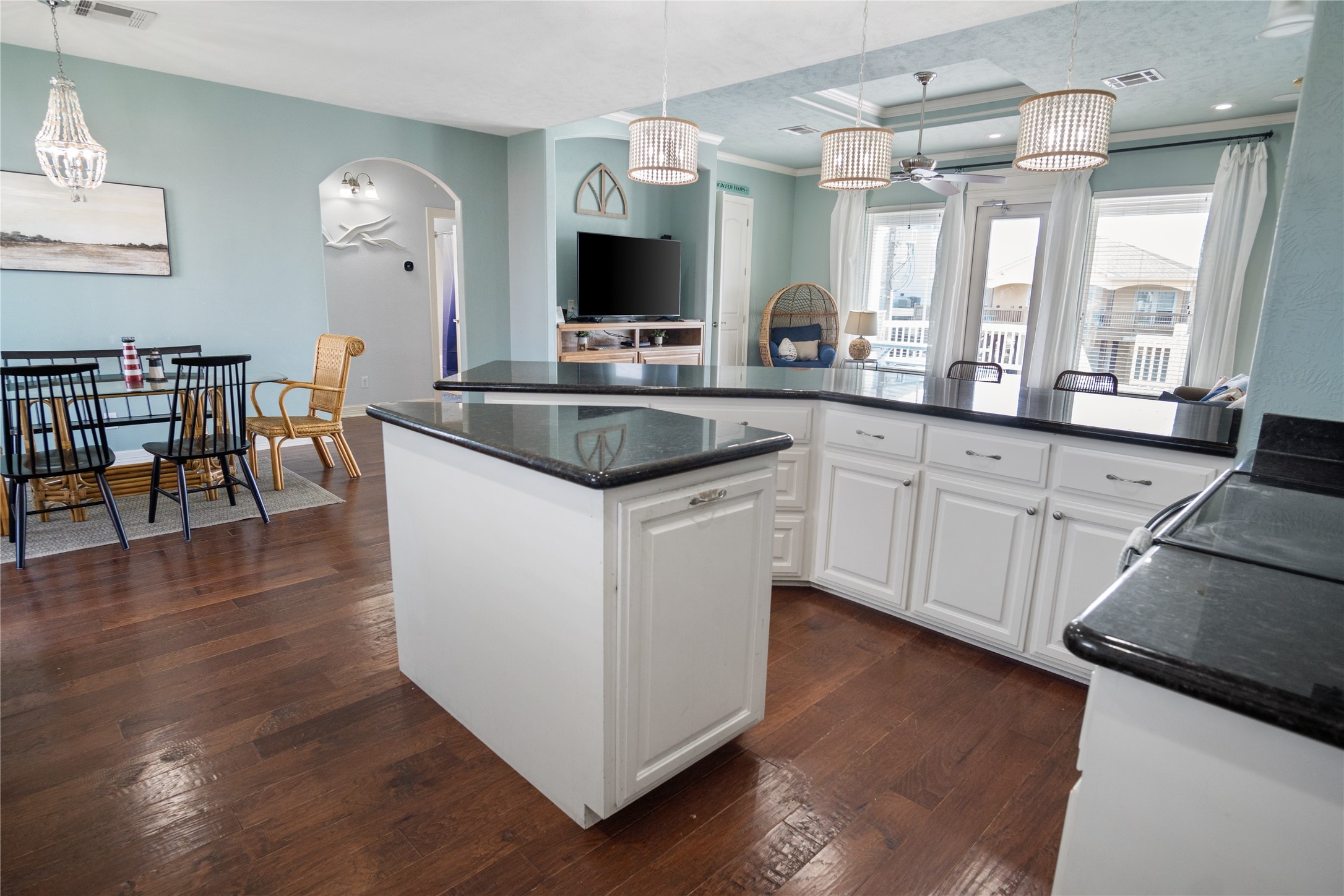 932 Kent Crystal Beach, TX 77650 - Photo 10 of 37 a kitchen with granite countertop a sink cabinets and wooden floor