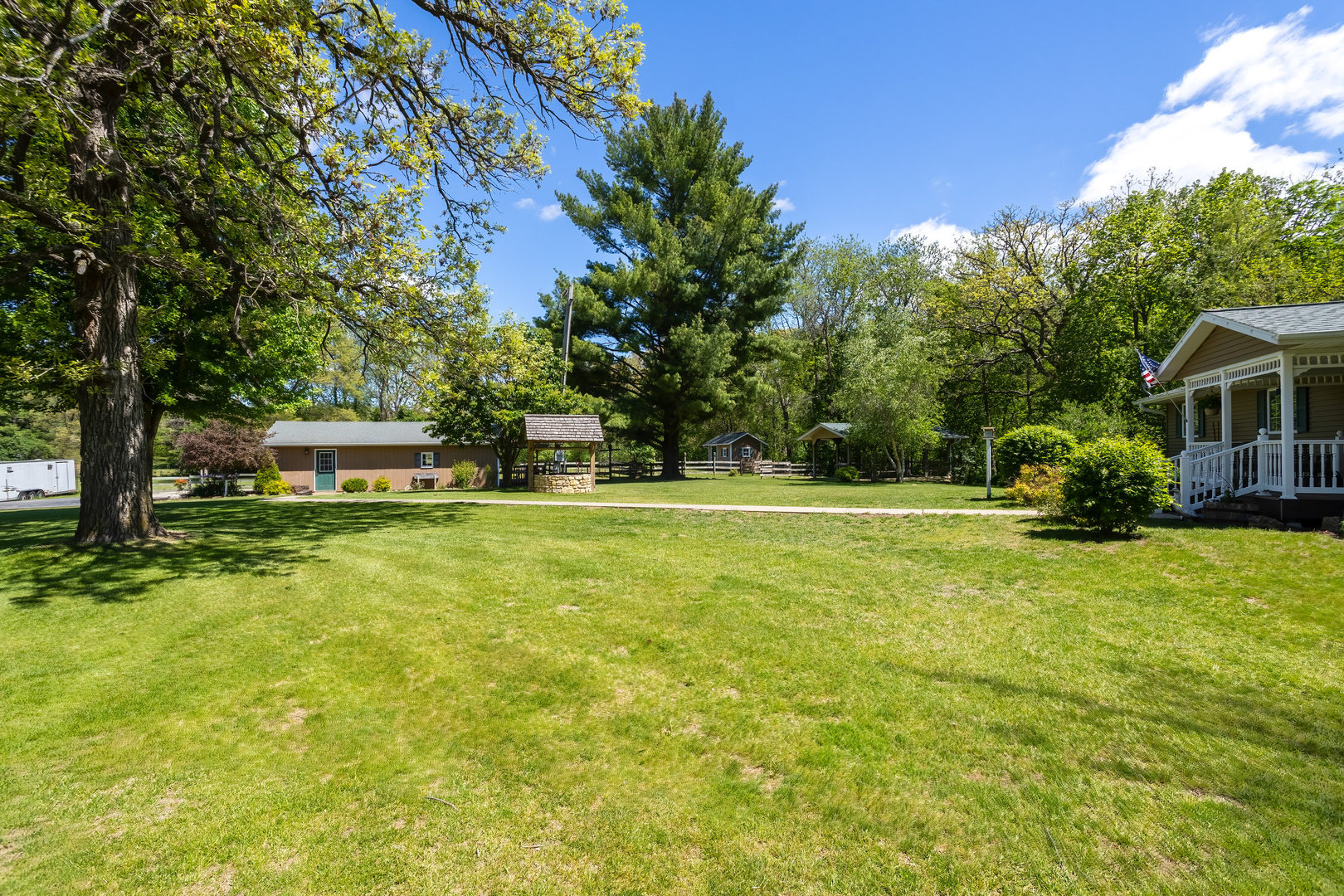 2660 252nd Street De Witt, IA 52742 - Photo 5 of 45 a front view of a house with garden