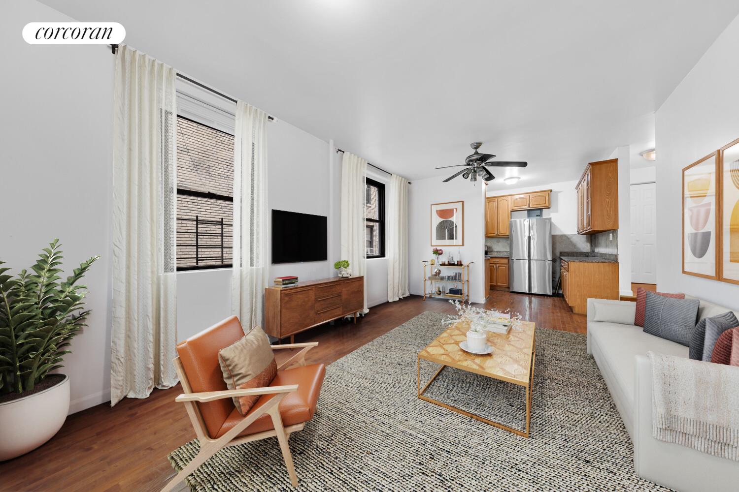 21-28 35th Street, Unit 1H Queens, NY 11105 - Photo 1 of 8 a living room with furniture wooden floor and a flat screen tv