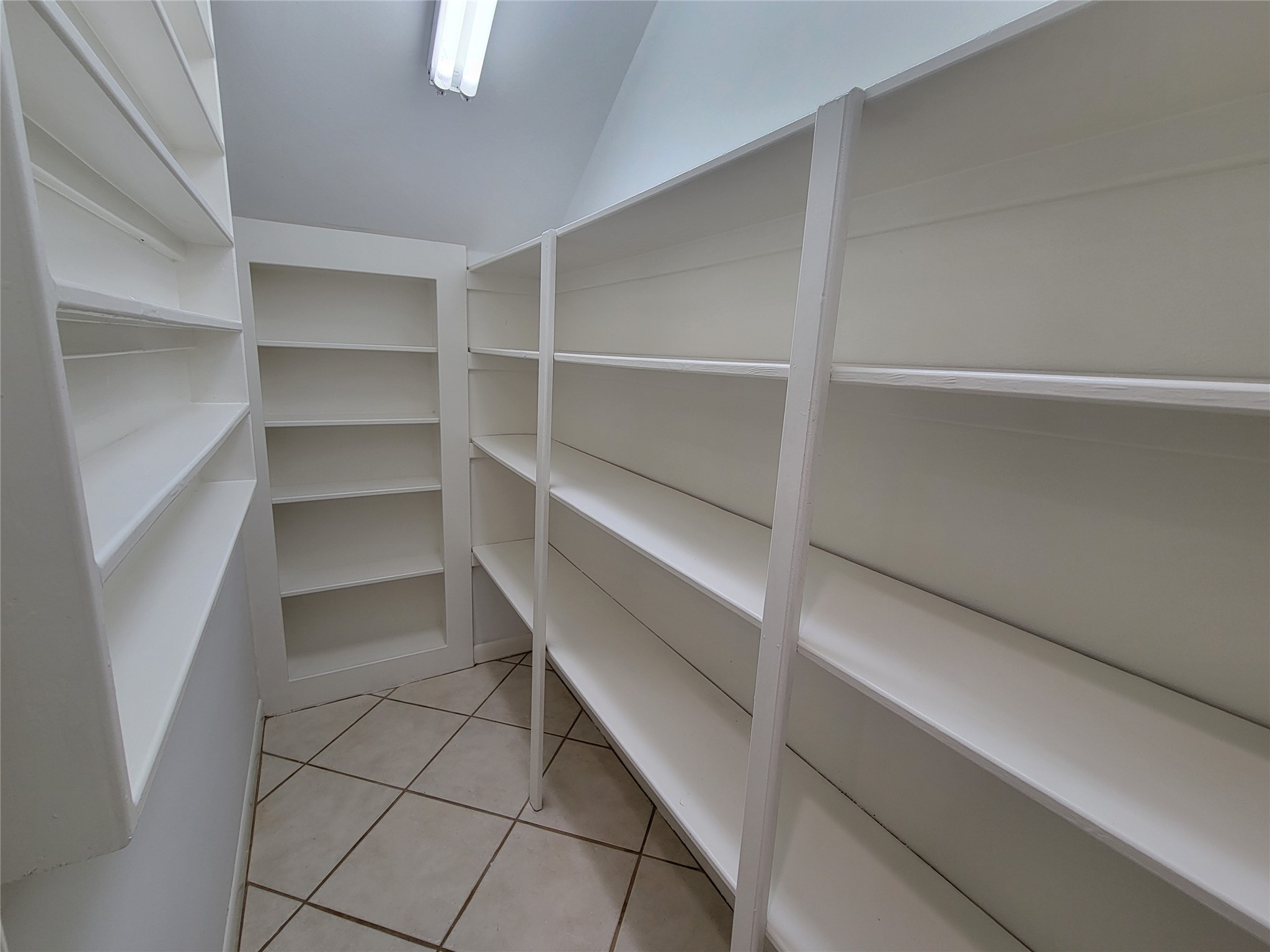 10 Dovewood Place The Woodlands, TX 77381 - Photo 13 of 34 a view of walk in closet with empty racks