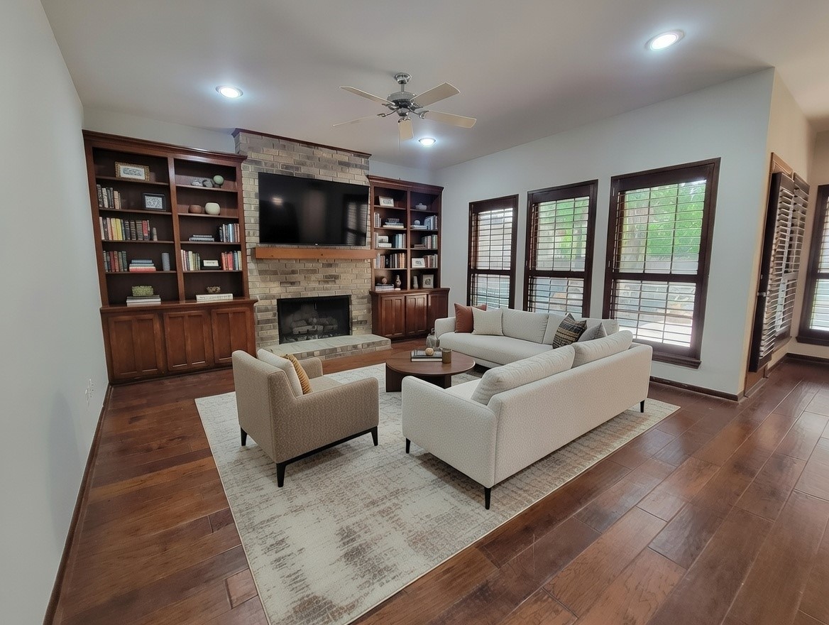 10 Dovewood Place The Woodlands, TX 77381 - Photo 17 of 34 a living room with furniture and a fireplace