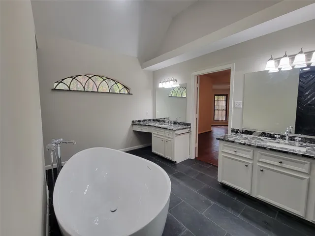 a kitchen with cabinets a sink and appliances