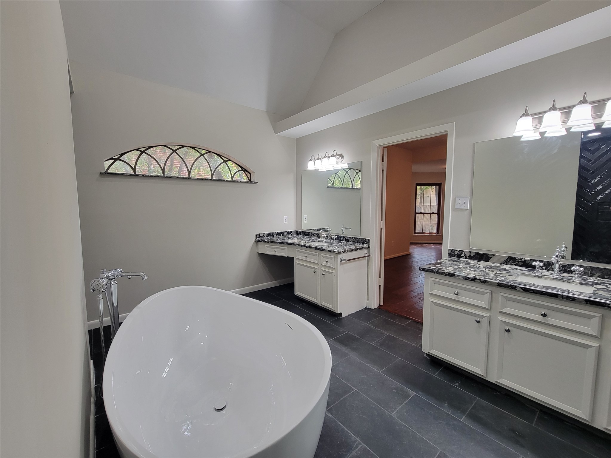 10 Dovewood Place The Woodlands, TX 77381 - Photo 23 of 34 a kitchen with cabinets a sink and appliances