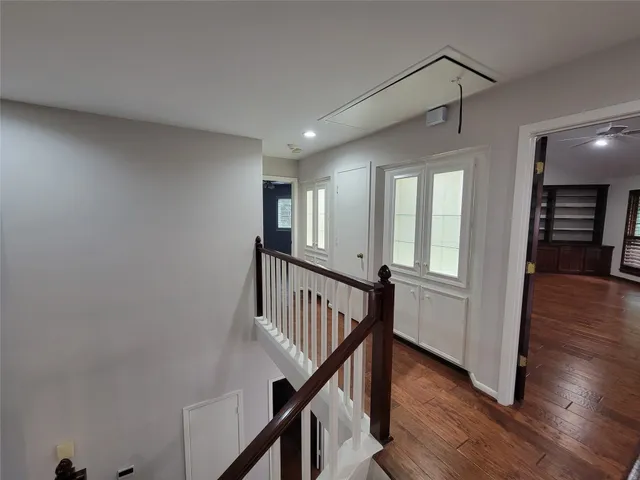 a view of an entryway with wooden floor and stairs