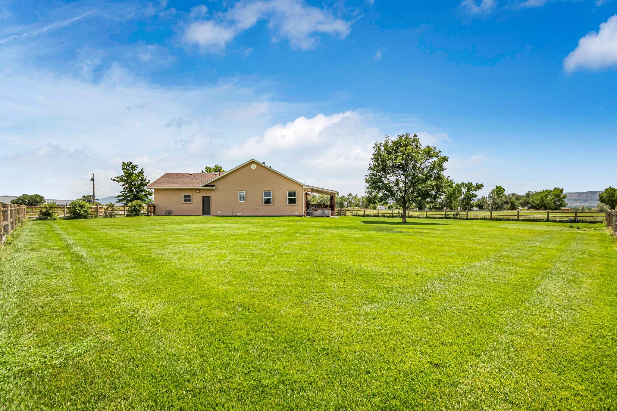 985-20 20 1/2 Road Fruita, CO 81521 - Photo 13 of 42 a view of swimming pool with an outdoor space and seating area