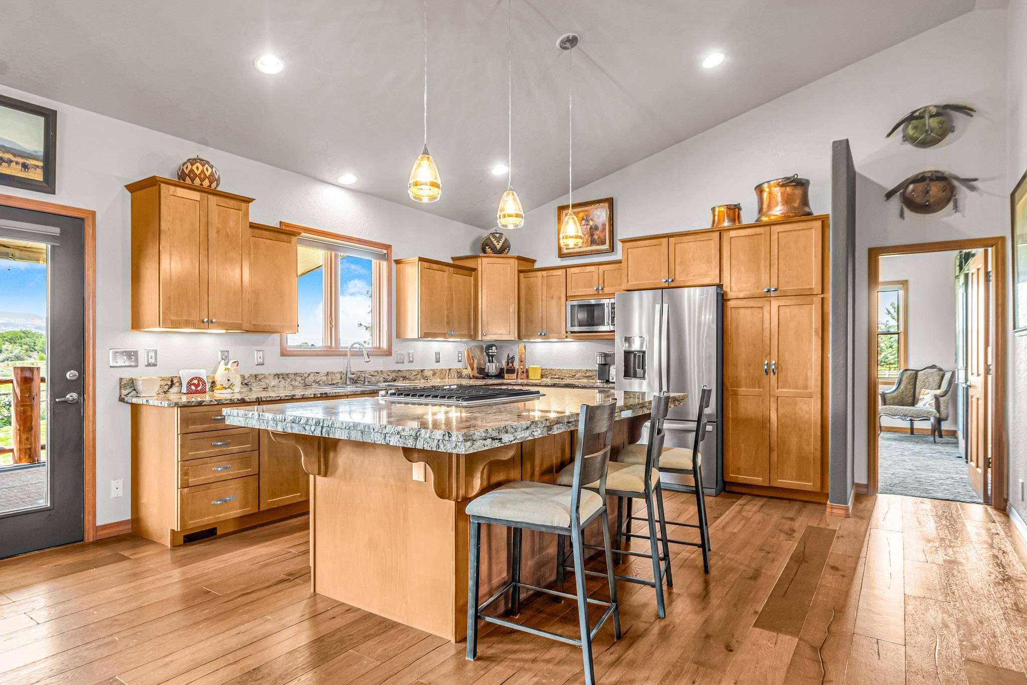 985-20 20 1/2 Road Fruita, CO 81521 - Photo 20 of 42 a kitchen with stainless steel appliances granite countertop a refrigerator a stove top oven and a refrigerator