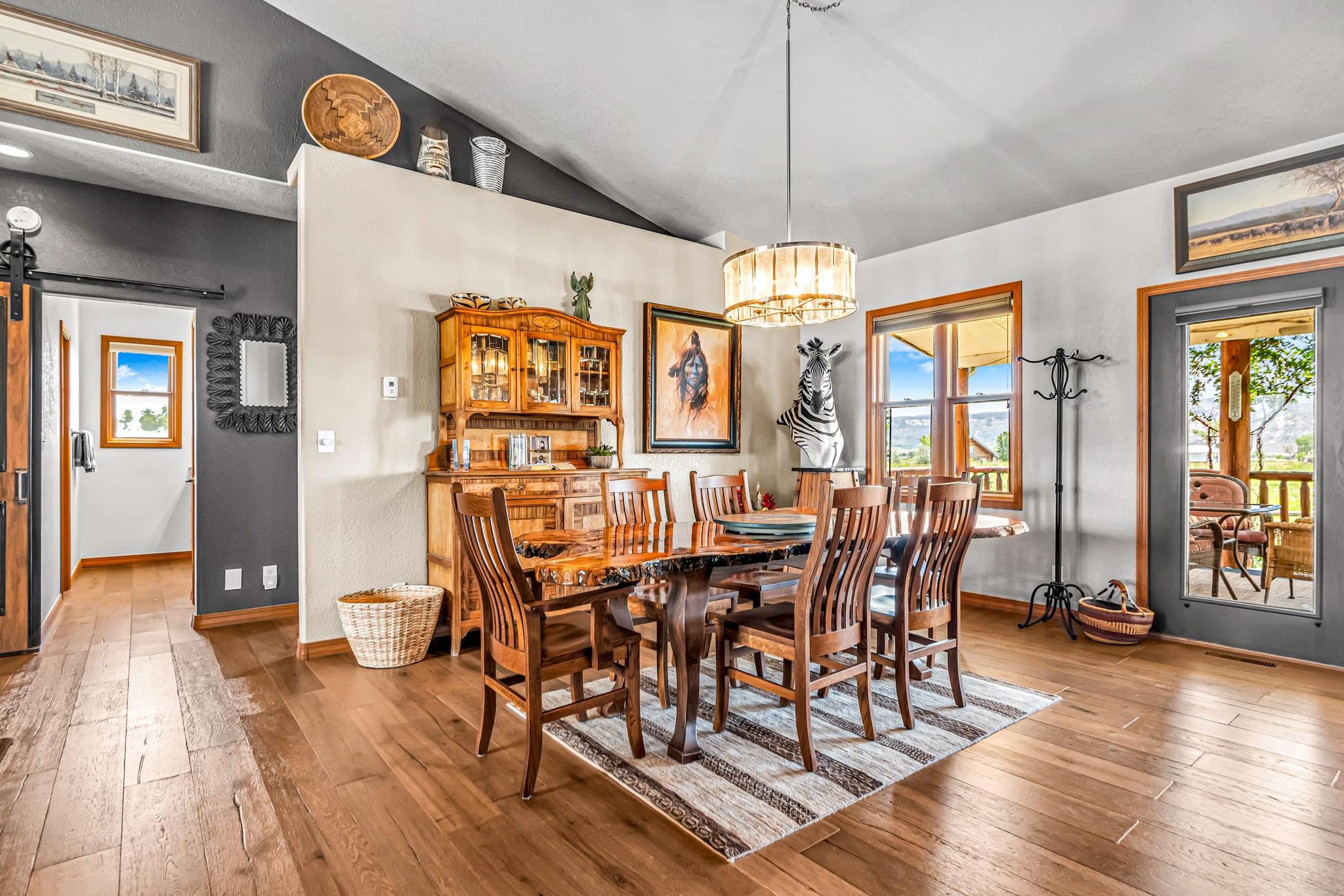 985-20 20 1/2 Road Fruita, CO 81521 - Photo 21 of 42 a view of a dining room with furniture window and wooden floor