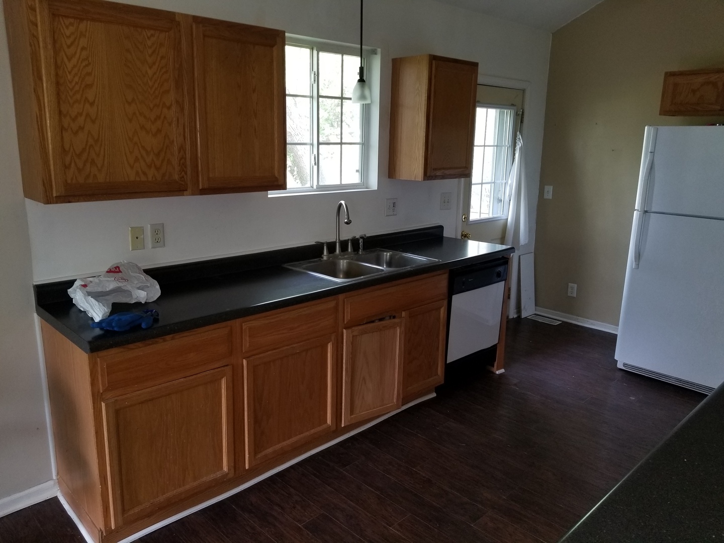 39477 North Hickory Avenue Antioch, IL 60002 - Photo 5 of 25 a kitchen with granite countertop a sink cabinets and wooden floor