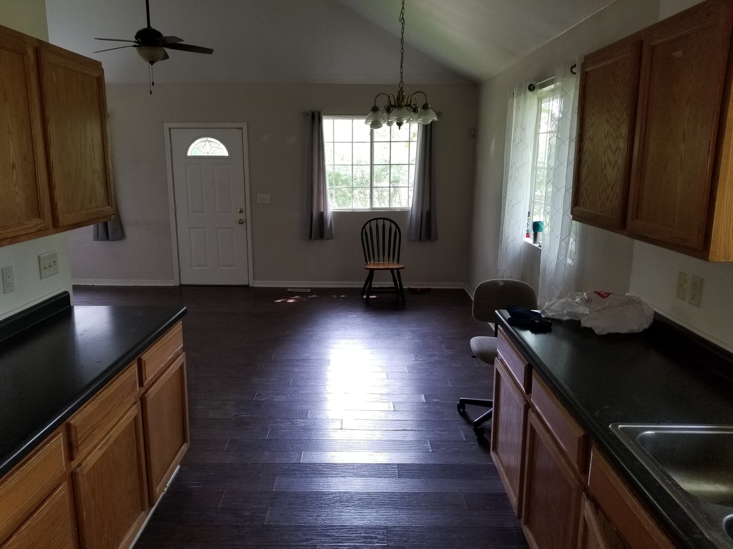 39477 North Hickory Avenue Antioch, IL 60002 - Photo 8 of 25 a kitchen with granite countertop a stove a sink wooden floor and cabinets
