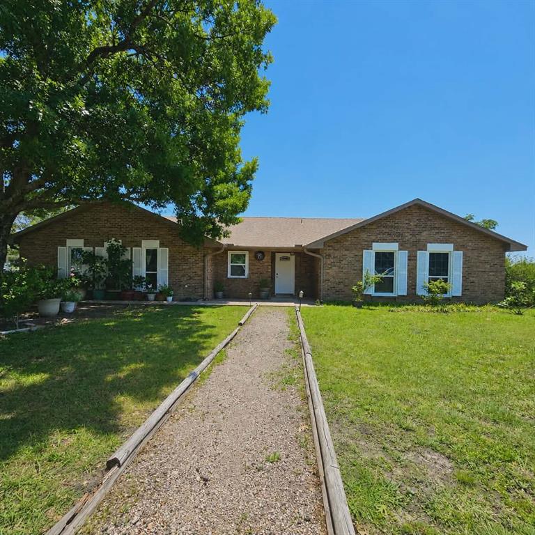 14752 Ranch Road Forney, TX 75126 - Photo 3 of 40 Brick exterior featuring white louvered shutters and a white entry door