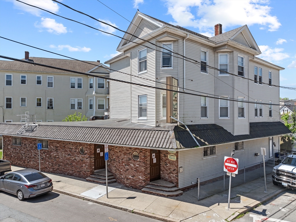 915 County Street Fall River, MA 02723 - Photo 5 of 5 a front view of a building with a street