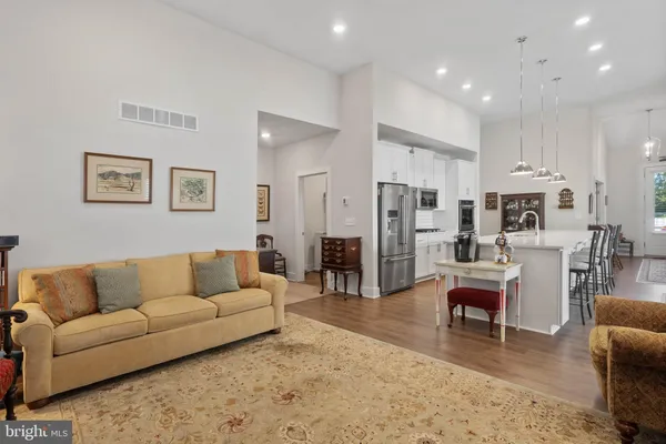 a living room with furniture rug and window