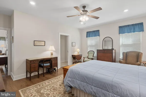 a bedroom with a bed and furniture