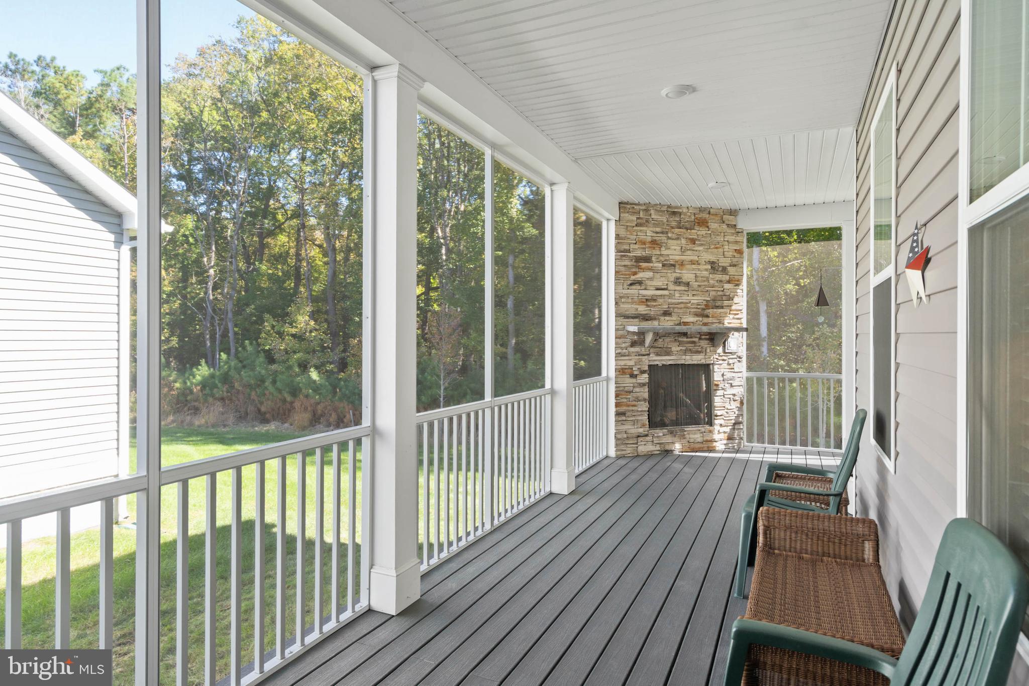 18573 Emerson Way Georgetown, DE 19947 - Photo 30 of 51 L-Shaped Rear Screened Porch with Gas Fireplace