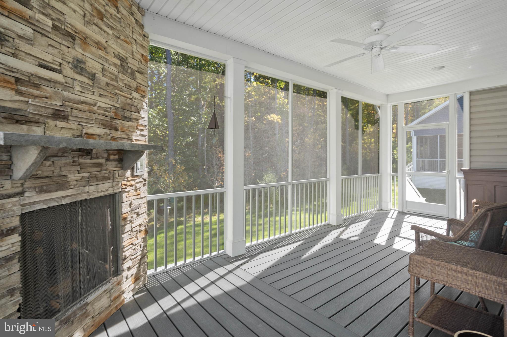 18573 Emerson Way Georgetown, DE 19947 - Photo 31 of 51 L-Shaped Rear Screened Porch with Gas Fireplace