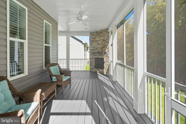 a view of a balcony with wooden floor
