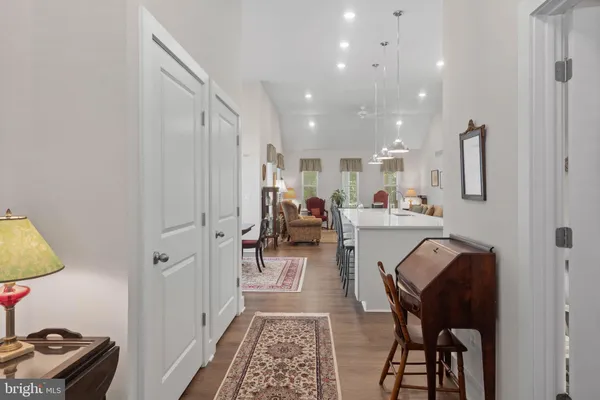 a living room with furniture and a chair
