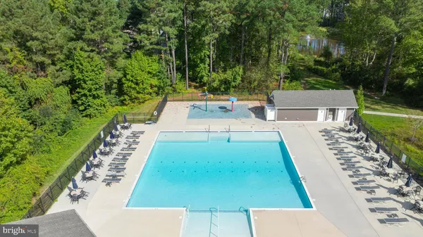 a aerial view of a house with swimming pool and garden