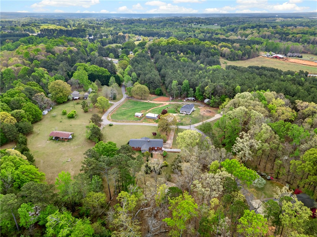 160 Burdette Circle Pendleton, SC 29670 - Photo 35 of 38 This serene aerial view captures a sprawling rural landscape with lush greenery and scattered homes.