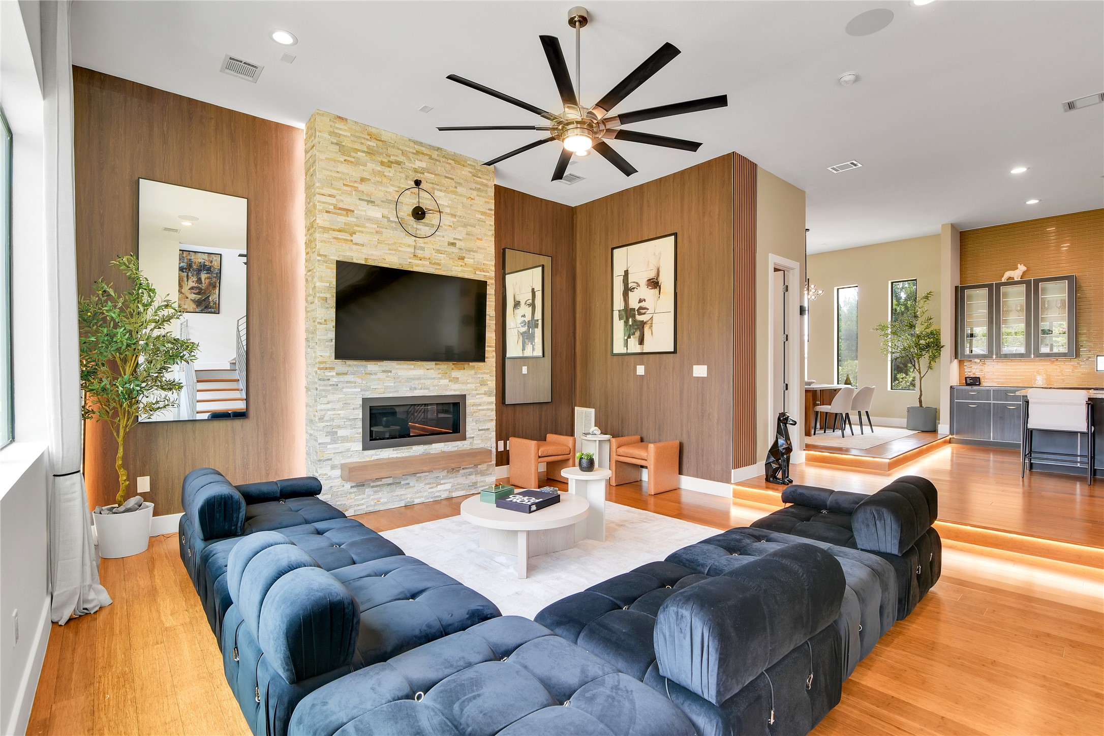 1411 Hickory Street Houston, TX 77007 - Photo 2 of 31 a living room with furniture a fireplace and a flat screen tv